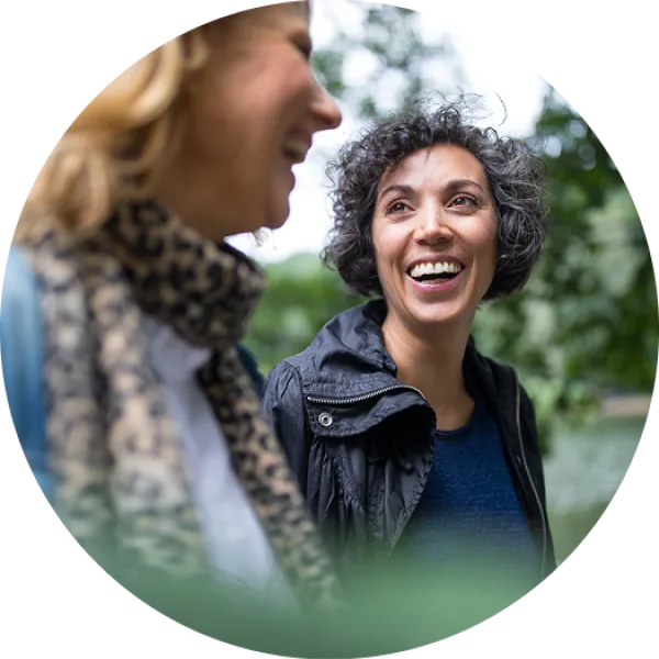 Two women outside, smiling.