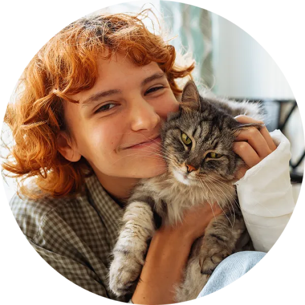 Women hugging a cat.